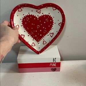 Heart-Shaped Red and White Decorative Plate and “book” stack